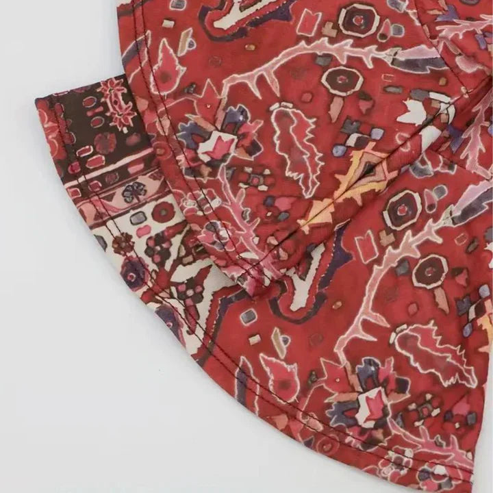 Red top with 3/4 length sleeves and V-neckline